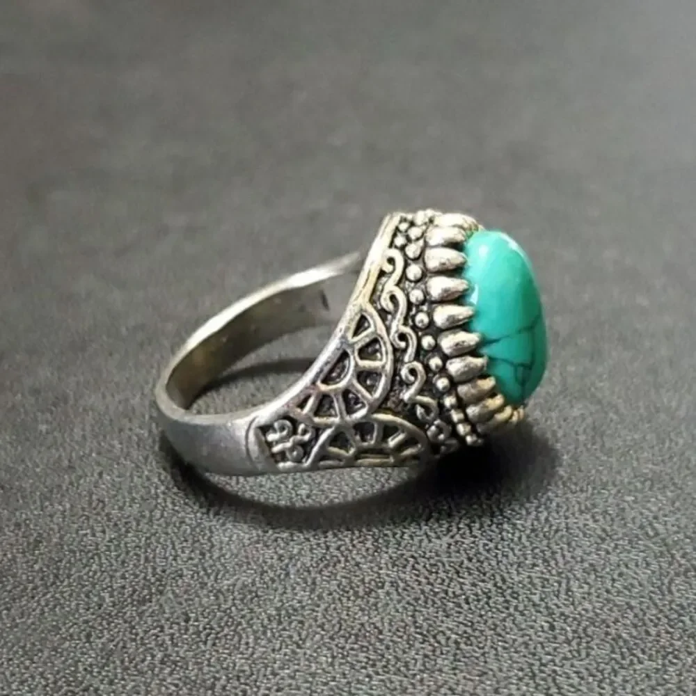 Silver tone ring with blue stone approx 11